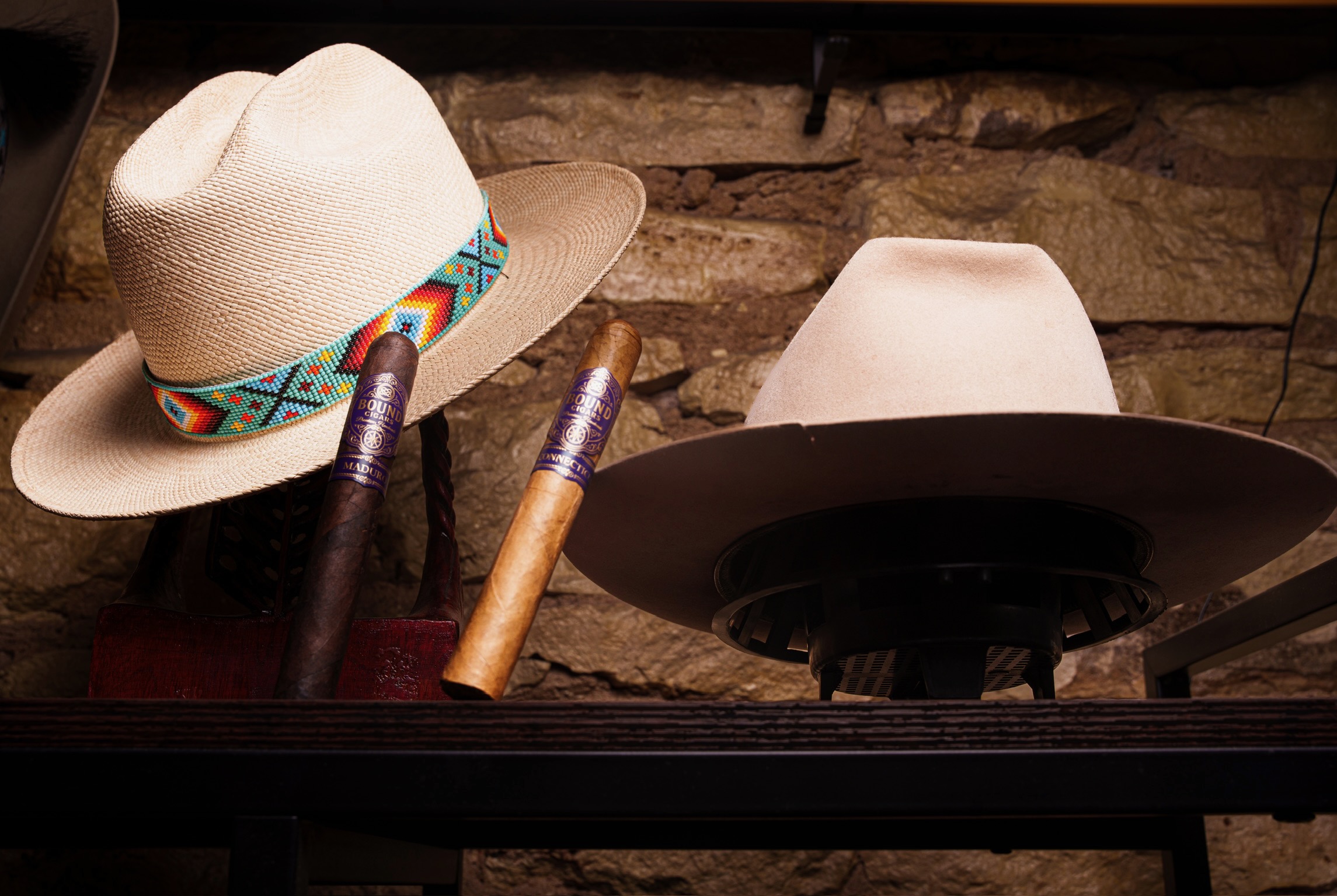 Two hats with Bound cigars