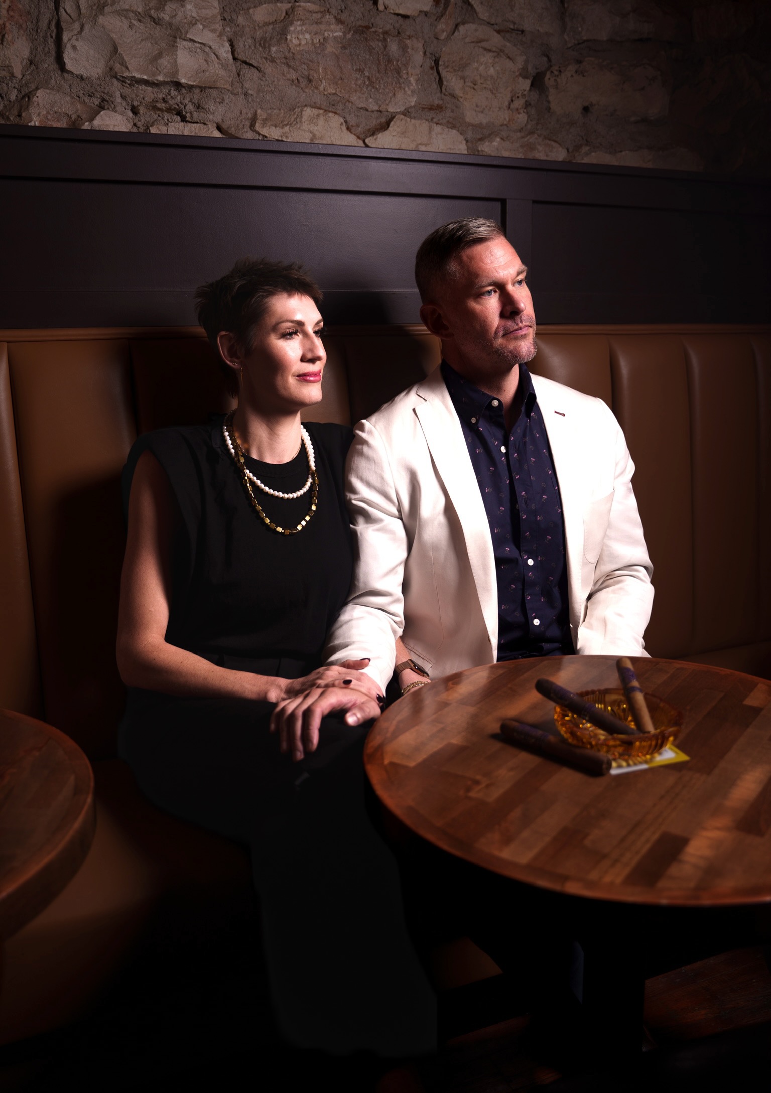 Kelly Corcoran and Drew Fowler seated together in a booth