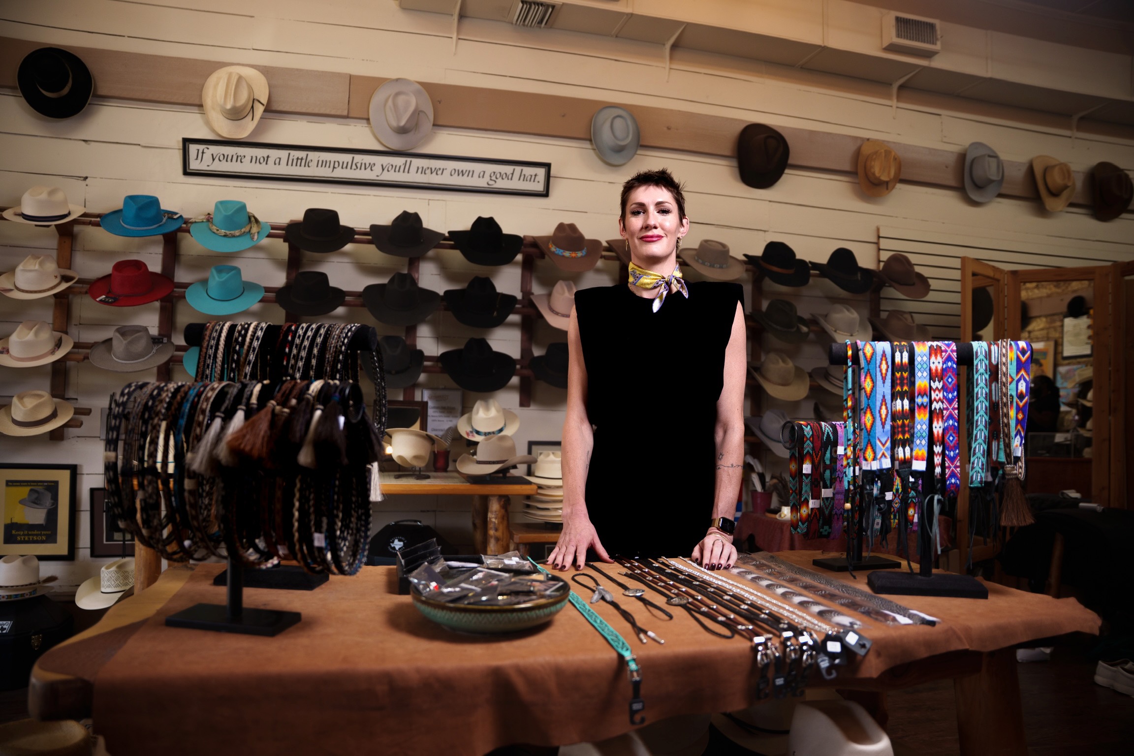 Kelly Corcoran at a hat shop counter